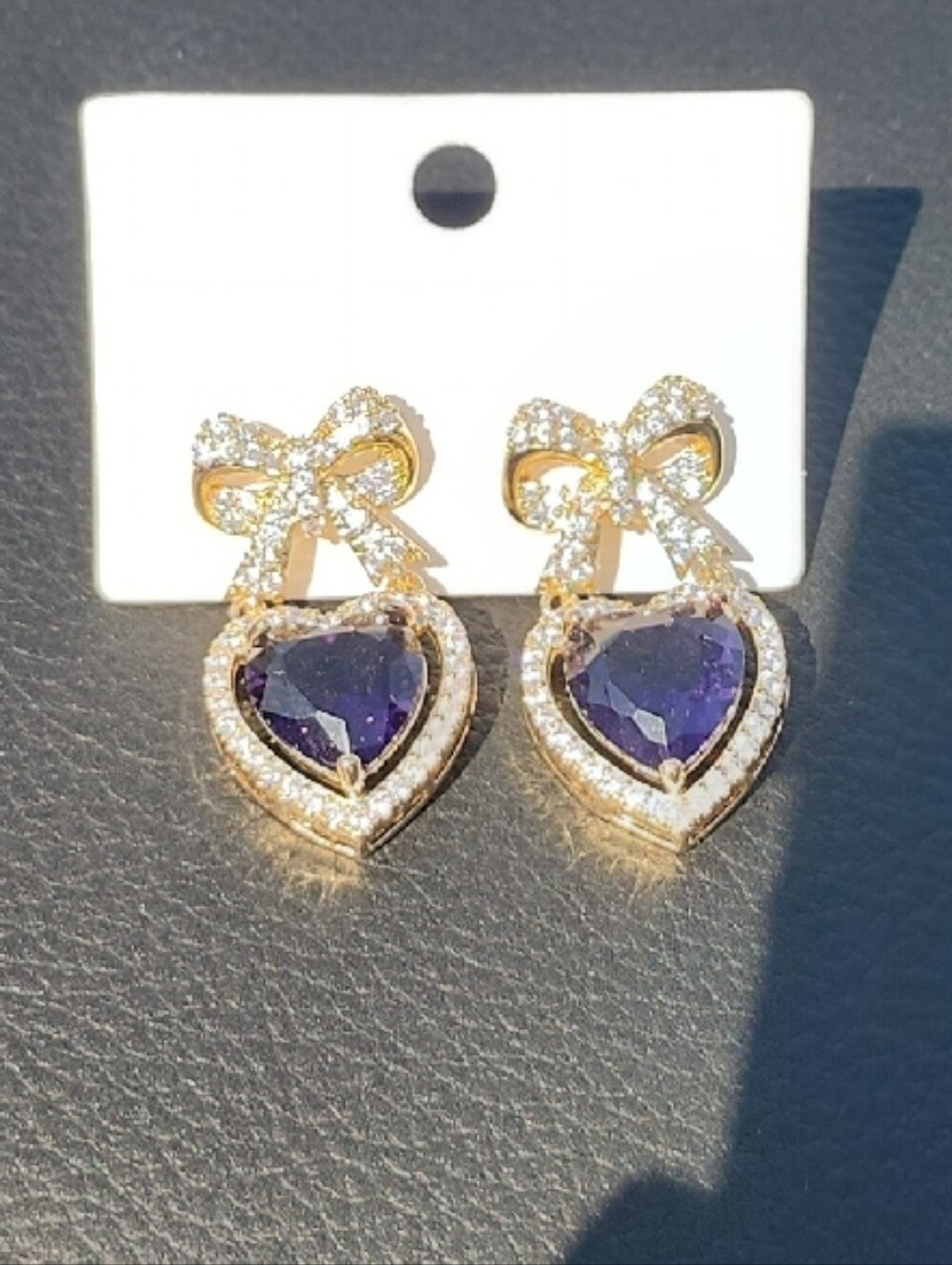 Gold Bow Earrings with Purple Heart Gemstones